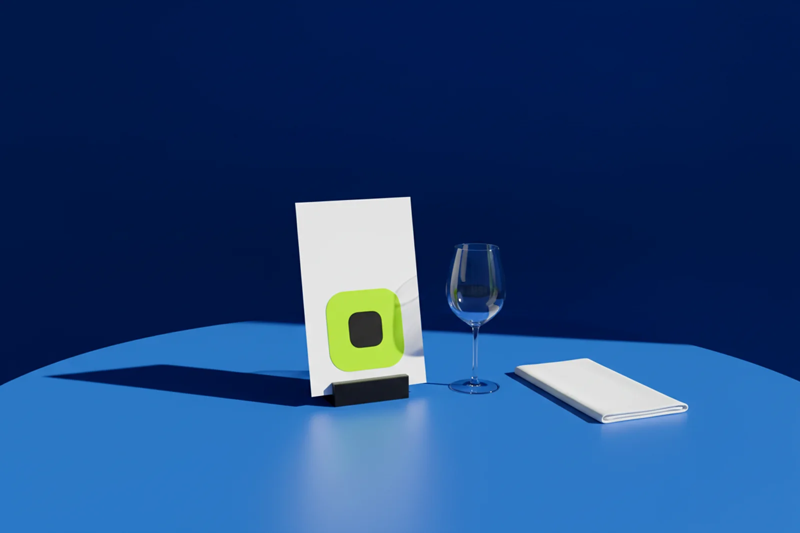 A table tent on a linen tablecloth in a candlelit dining room, with an AriaQR code made from the restaurant's signature dish photograph and the words "scan for the menu."